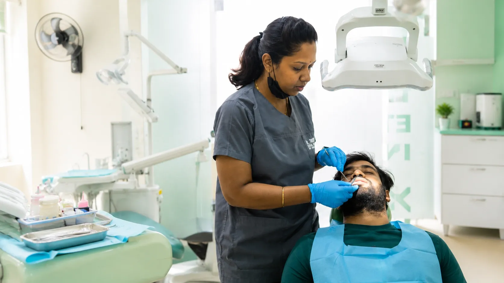 Dr. Jyothi Sajjan Treating Patient Portrait